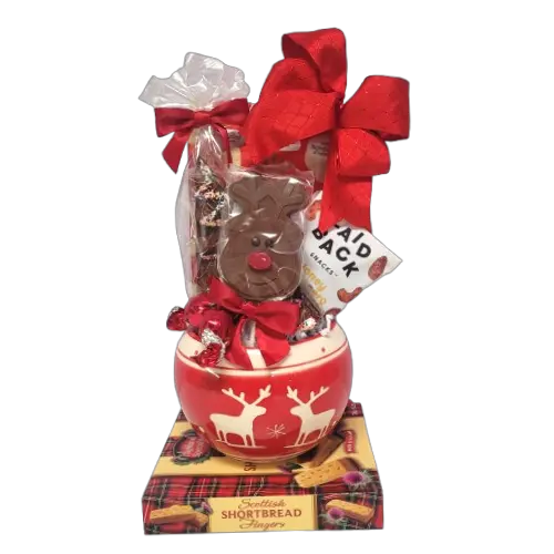 A Christmas candy bowl filled with lots of scrumptious treats. There's a chocolate lolly, tasty nuts, chocolate pretzels and biscuits too!