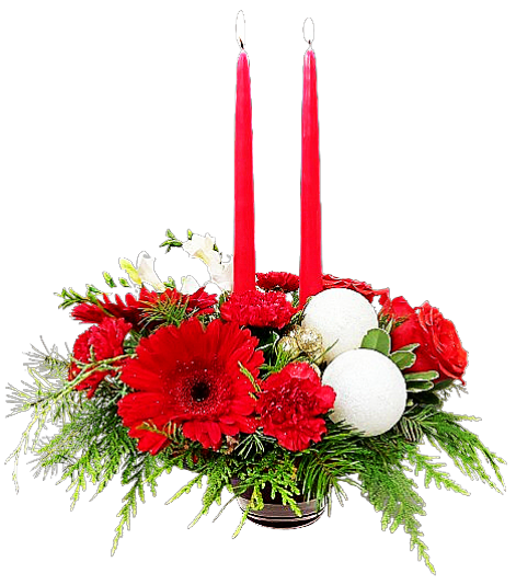 A candlelight centrepiece surrounded by an assortment of Christmas greens with red and white florals and decorations.