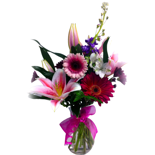 Vase floral arrangement with lilies, gerbera and more.