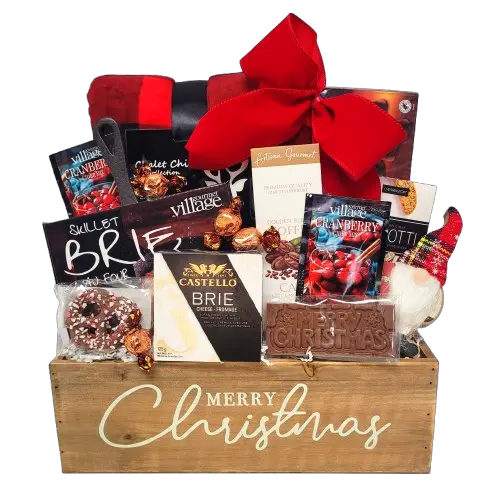 Send your very best Merry Christmas wishes with this beautiful wooden gift basket loaded with all the warm Christmas comforts. There's a cozy blanket to snuggle under while the treats are enjoyed. There's a brie topper skillet, cheese and crackers, chocolate, hot drink mixes, coffee, cookies, truffles and a wonderful Christmas ornament to keep.