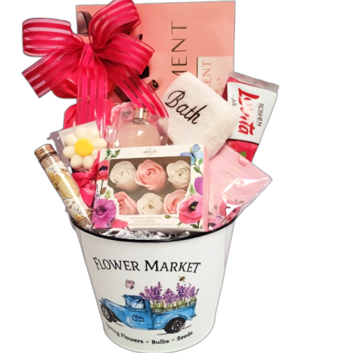 Mother's Day gift basket filled with chocolate, cookies, bath salts, soap petals, bubble bath and a scented sachet.