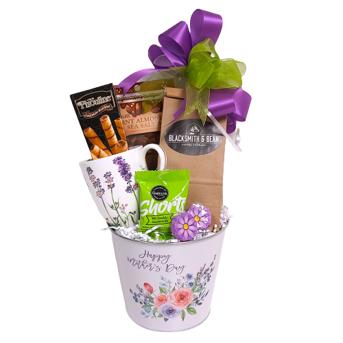 Happy Mother's Day gift basket filled with a mug, coffee, biscuits, chocolate and shortbread.