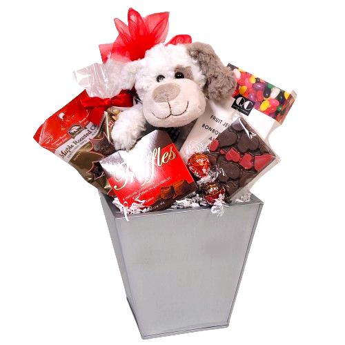 A basket of tasty treats with a plush puppy inside.
