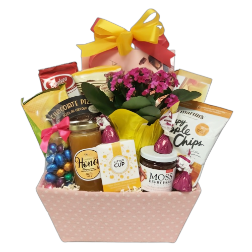 A gift basket loaded with honey, tea, jam, an assortment of chocolate delights, popcorn, biscuits and more.