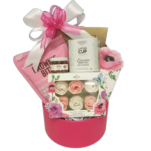 Our Sweet Kisses Valentine's gift basket is thoughtfully crafted with delicate rose-scented soap petals, delectable sweets and a touch of honey. Included is a selection of soothing teas for a moment of relaxation and indulgence. Sure to provoke sweet Valentine's kisses.