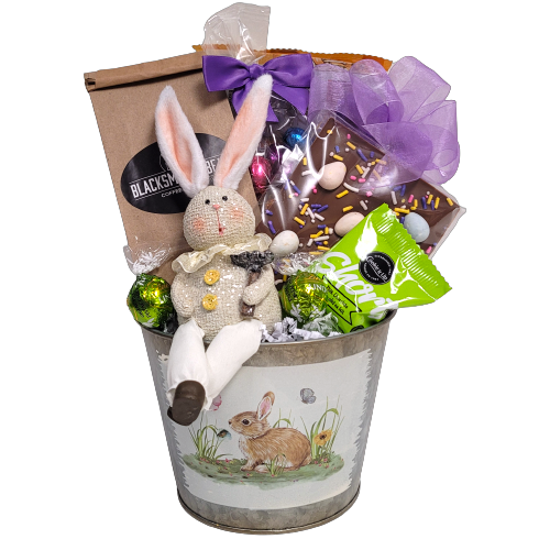 An Easter bunny tin filled with gourmet coffee, chocolate Easter eggs, cookies, chocolate Easter bark, shortbread and a cute little bunny.