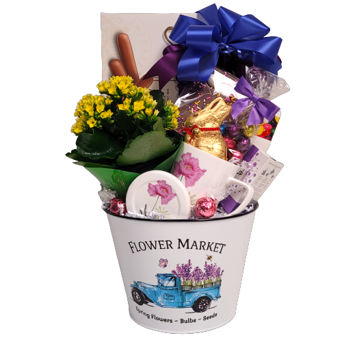 Flower Market tin pot is a pretty flowering plant to nurture and grow along with a pretty mug, some tea and lots of treats, of cookies, a chocolate bunny, chocolate Easter eggs, jelly beans and more.