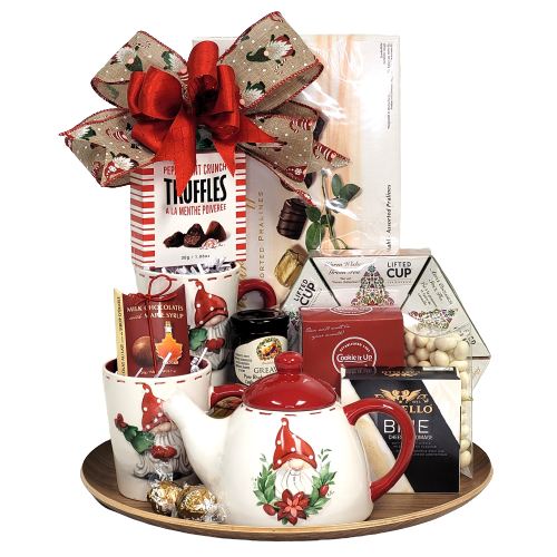 They'll cozy up at home with this beautiful keeper. A tray loaded with chocolate, truffles, tea, jam, cookies, crackers and cheese along with a festive teapot and two matching mugs. There's treats to enjoy and treasures to keep! Tray styles may vary.