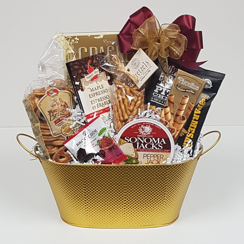 A tin loaded with crackers and cheese, biscuits, chocolates, pretzels and more.