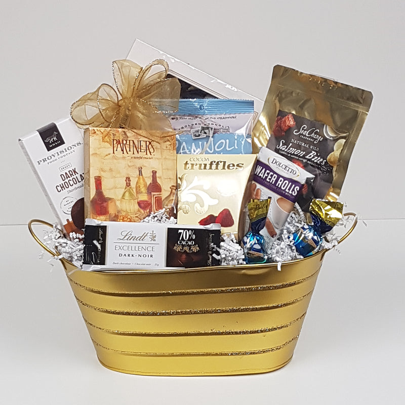 A tin filled with shortbread, chocolates, biscuits, crackers, Sea Change salmon, truffles and more.
