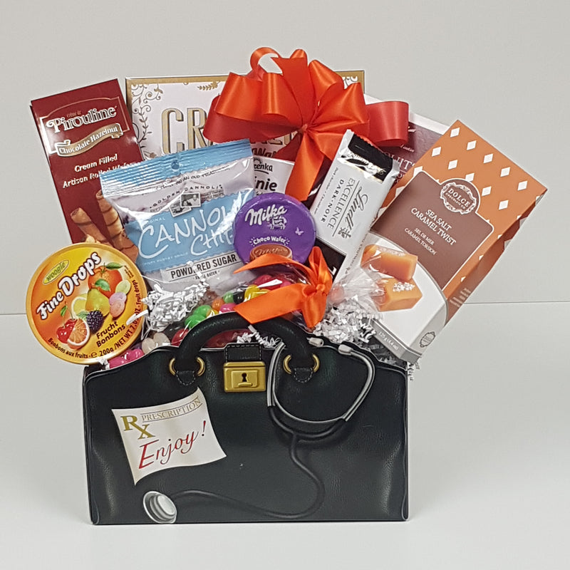 A box shaped like a doctor's bag filled with crackers and candy, chocolates, biscuits and more.