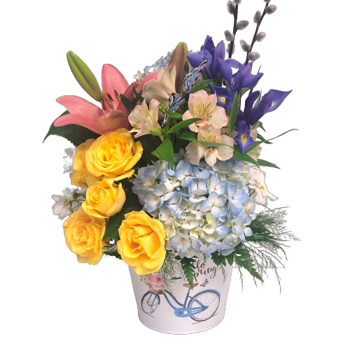 Flower arrangement designed in "Hello Spring" pot with roses, lilies, irises and hydrangea too.