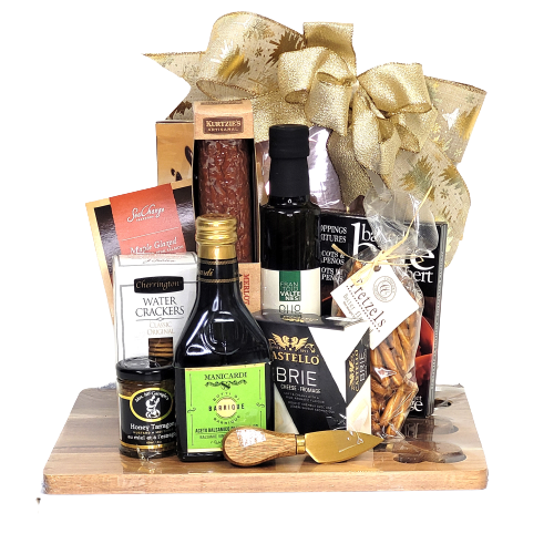 A cheese board and knife set with artisanal salami, oil, vinegar, cheese, mustard, salmon, chocolate and more.