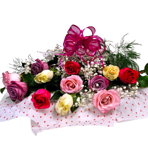 Perfect presentation style of one dozen soft coloured roses in pinks, lavender and cream.
