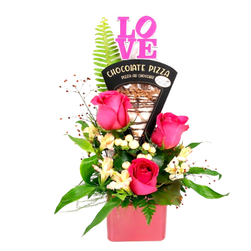 Floral arrangement of roses with an added treat of a slice of chocolate pizza.