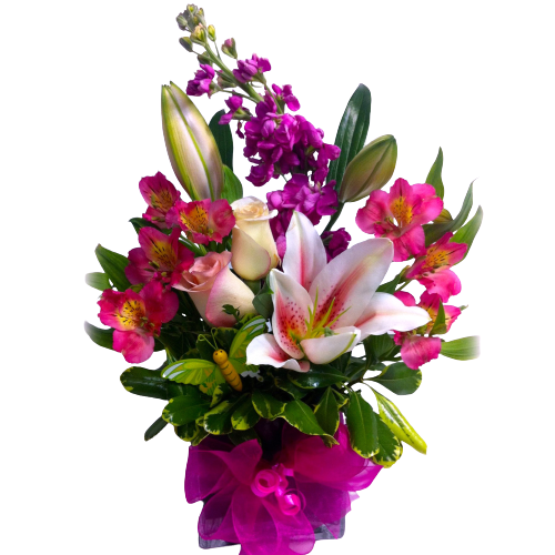 Floral vase arrangement with roses, lilies and more all in hues of pinks, whites and creams.