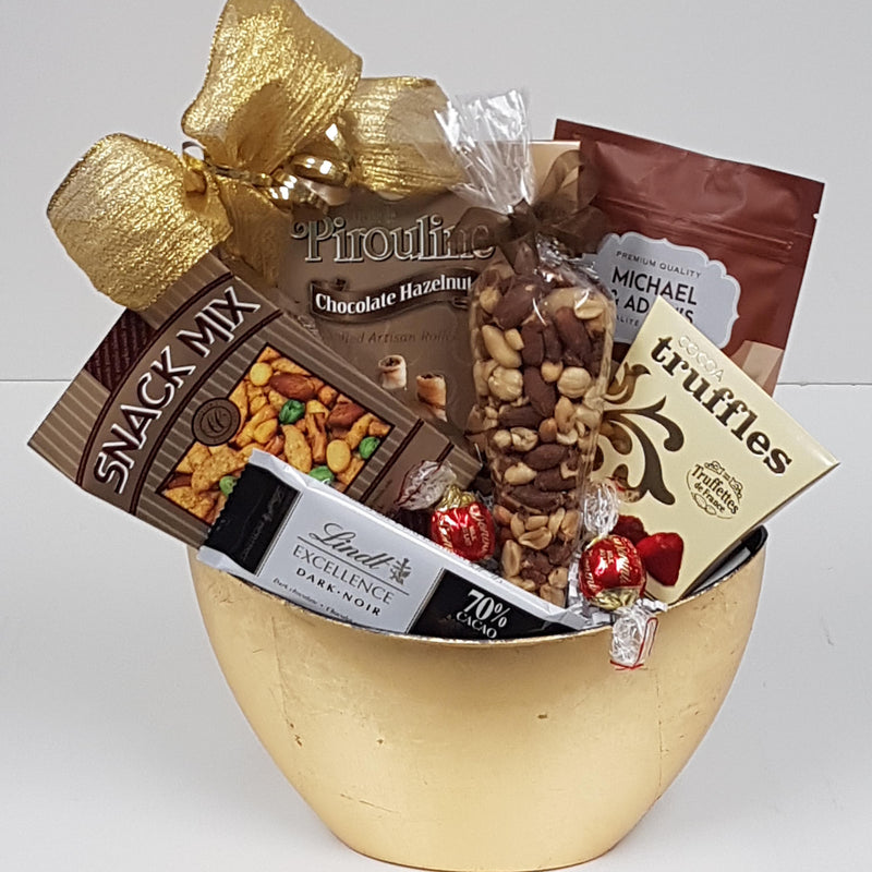 A ceramic bowl filled with sweet and salty treats.