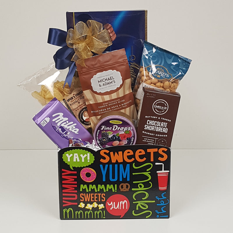 A gift package filled with  European chocolate, nuts, shortbread, chocolate chips, and more.
