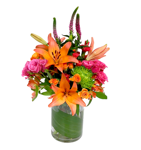 A floral vase arrangement with lilies, veronica, spray roses and alstromeria in hues of bright orange, fuchsia and green.