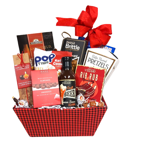 A gift basket of pretzels, peanut brittle, nuts, chocolate, popcorn, BBQ sauce, seasoning and more.