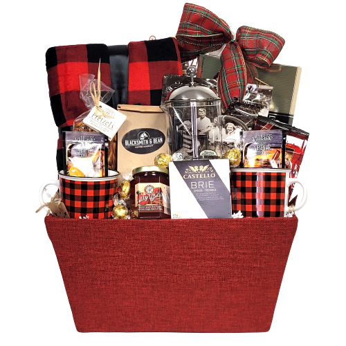 A cozy fleece blanket, coffee press, a pair of mugs, coffee, cider mix, chocolates, truffles and more.