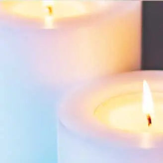 White lit candles for sympathy