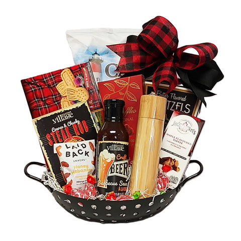 Our BBQ wok is filled with craft beer BBQ sauce, a sleek pepper mill, nuts, truffles, shortbread, pretzels and chips.