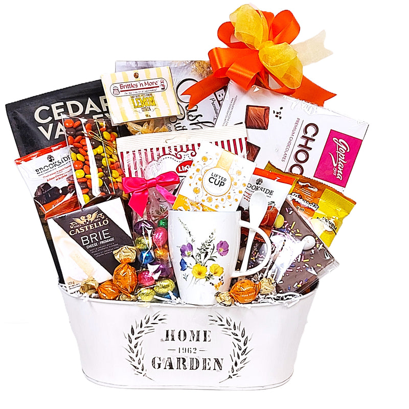 There's lots of surprises loaded in this Easter gift basket. There's a beautifully designed tea mug, tea, nuts, candies, crackers & cheese, chocolate easter eggs and more to complete the surprise delivery! A tasty Easter surprise gift basket!