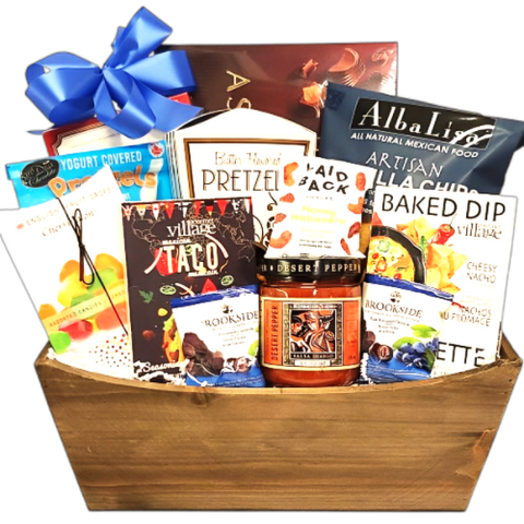 A gift basket with gourmet taco seasoning, salsa and baked dip mix, along with pretzels, chocolate, caramel corn, tortilla chips, nuts and more.
