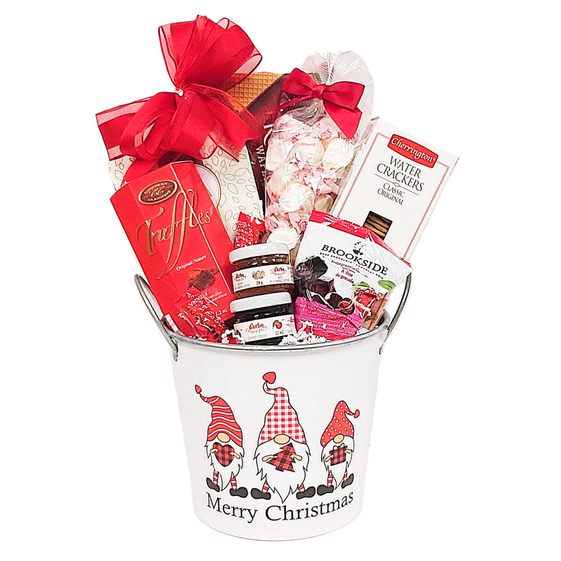 Every gnome will enjoy the delicious treats in this Christmas gift basket. There's Roshen cookie wafers, salt water taffy, tea, truffles, mini honey and jam, crackers and candy treats too.
