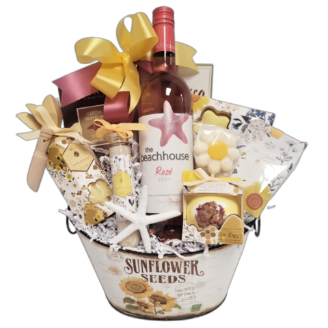 A Gift Basket filled with sweet treats, bath and shower indulgences and wine.