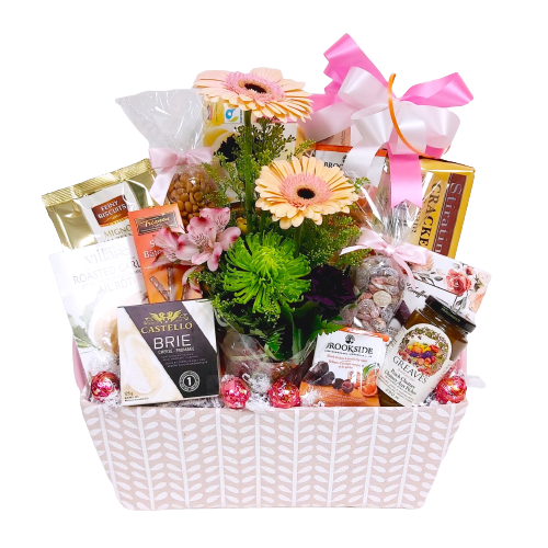 Nestled in with a wonderful assortment of delicious delights is a pretty floral arrangement to enjoy. There's cookies, nuts, candy, cheese, crackers, chocolate and more.