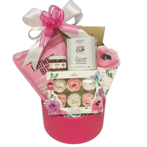 Our Sweet Kisses Valentine's gift basket is thoughtfully crafted with delicate rose-scented soap petals, delectable sweets and a touch of honey. Included is a selection of soothing teas for a moment of relaxation and indulgence. Sure to provoke sweet Valentine's kisses.