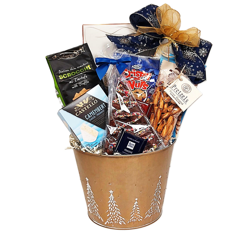 Send warm wishes with this holiday gift basket loaded with loads of tasty treats. Our golden Christmas tin is brimming with truffles, crackers, cheese, nuts, pretzels, wafer biscuits and a chocolate Christmas tree delight.