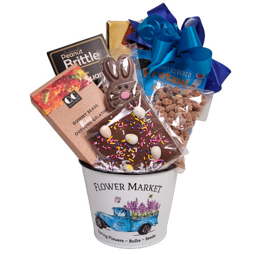 So many treats to enjoy in this pretty flower pot. It's brimming with peanut brittle, candy, chocolate, nuts and pretzels too! A touch of spring and a touch of Easter too!