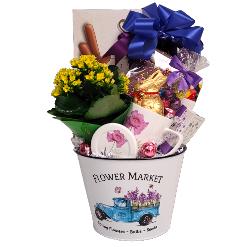 A pretty Flower Market tin pot holds a pretty flowering plant to nurture and grow, a beautiful mug with lid, chocolate Easter bunny, jelly beans, cookies, tea and more.