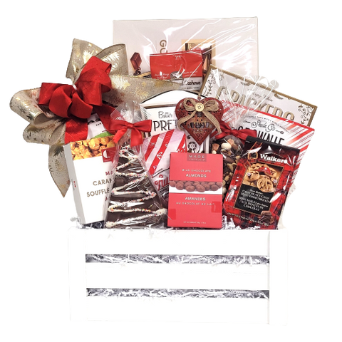 A wooden crate filled with cookies, cashews, apple chips, popcorn, pretzels, brittle, chocolate, a keepsake ornament and much more.