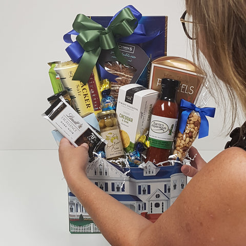 A stunning gift basket is being put together custom by one of the Baskets and Blooms Designers. 