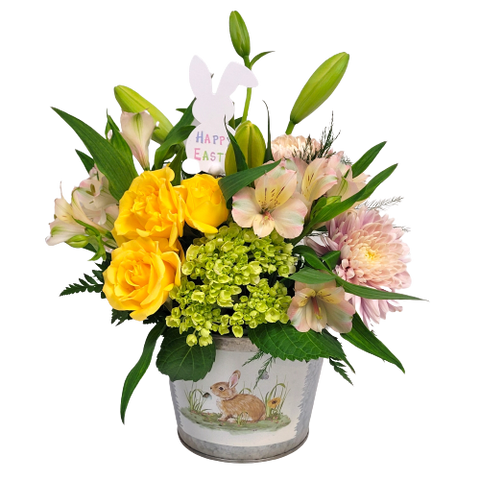A springtime bunny pot, soft pastels of roses, alstromeria, mums and hydrangeas.