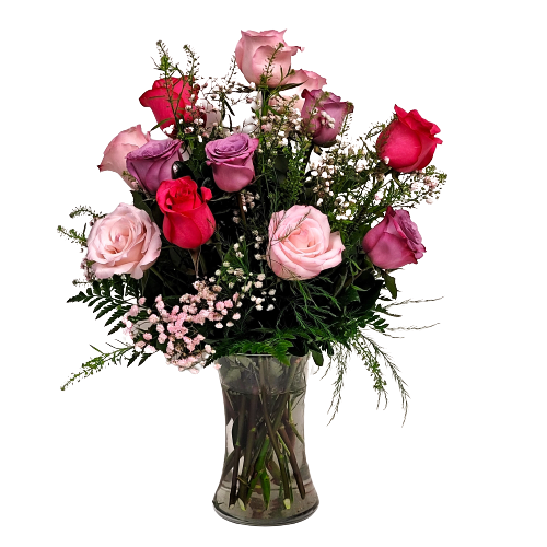 Vase flower arrangement of a dozen roses in pinks and lavender.
