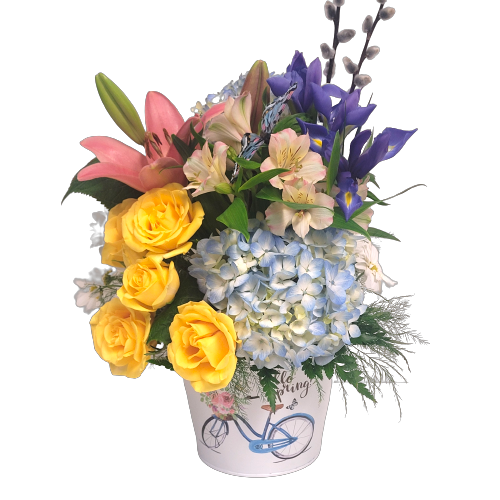 Say hello to spring with this beautiful floral arrangement of hues of pinks, blue and purple too! All nestled in our "hello spring" tin pot.  
