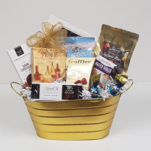 A tin filled with shortbread, chocolates, biscuits, crackers, Sea Change salmon, truffles and more.