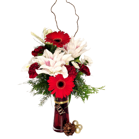 A red vase filled with florals and Christmas greens.
