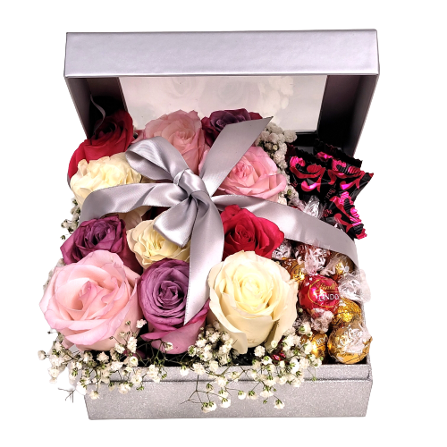Silver box with one dozen coloured roses of pinks, lavenders and cream with truffles.