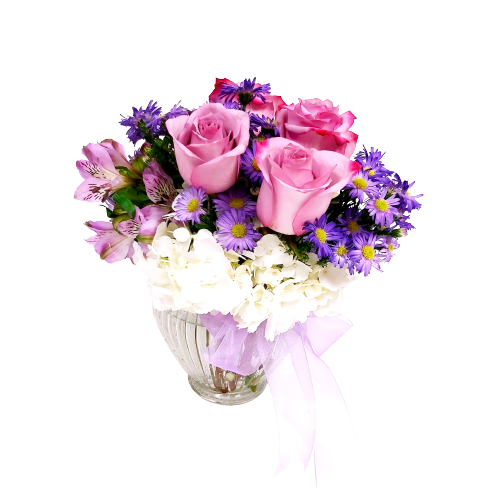 Floral arrangement of soft pastels of roses, hydrangeas and more.