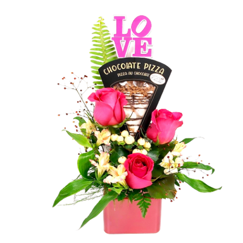 Floral arrangement of roses with an added treat of a slice of chocolate pizza.