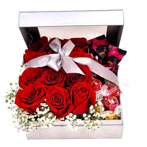 Silver box filled with one dozen red roses and truffles.