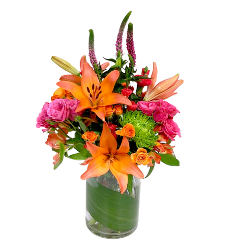 A floral vase arrangement with lilies, veronica, spray roses and alstromeria in hues of bright orange, fuchsia and green.