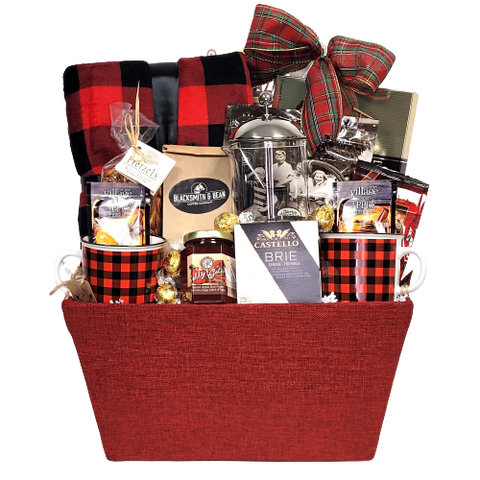 A cozy fleece blanket, coffee press, a pair of mugs, coffee, cider mix, chocolates, truffles and more.